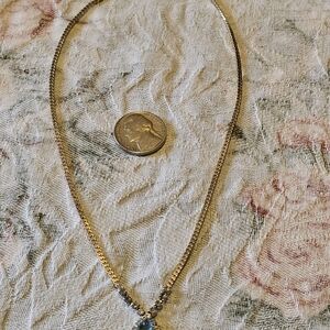 Gold Necklace with Blue Gemstone Pendant